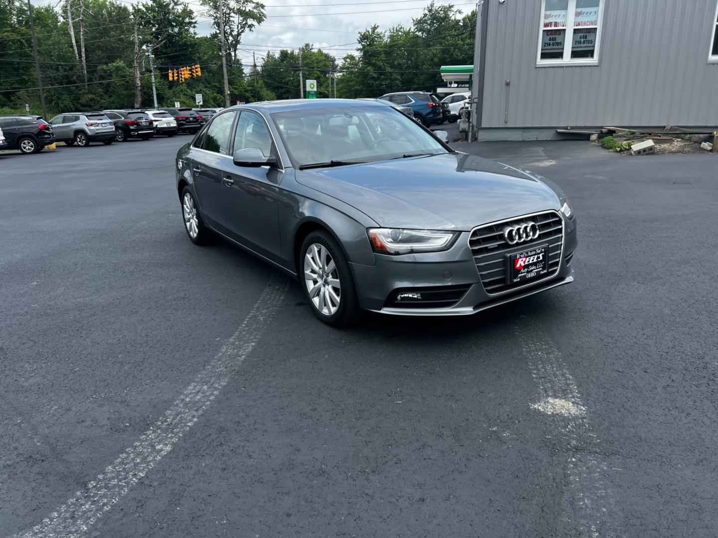 2013 Gray /Black Audi A4 2.0T Premium Sedan quattro (WAUBFAFL0DN) with an 2.0L I4 DOHC 16V TURBO engine, 8-Speed Automatic transmission, located at 11115 Chardon Rd. , Chardon, OH, 44024, (440) 214-9705, 41.580246, -81.241943 - This 2013 Audi A4 Premium Quattro is a refined luxury sedan that combines performance, comfort, and efficiency. It features a 2.0-liter turbocharged four-cylinder engine paired with an 8-speed automatic transmission and Audi's renowned Quattro all-wheel drive system. The A4 offers a blend of luxury - Photo#2