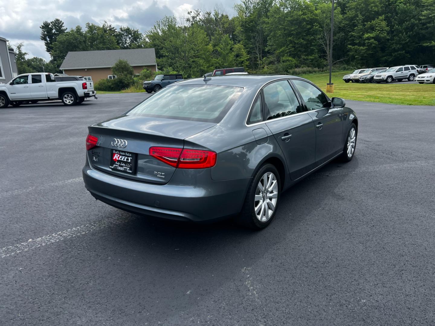 2013 Gray /Black Audi A4 2.0T Premium Sedan quattro (WAUBFAFL0DN) with an 2.0L I4 DOHC 16V TURBO engine, 8-Speed Automatic transmission, located at 11115 Chardon Rd. , Chardon, OH, 44024, (440) 214-9705, 41.580246, -81.241943 - This 2013 Audi A4 Premium Quattro is a refined luxury sedan that combines performance, comfort, and efficiency. It features a 2.0-liter turbocharged four-cylinder engine paired with an 8-speed automatic transmission and Audi's renowned Quattro all-wheel drive system. The A4 offers a blend of luxury - Photo#7