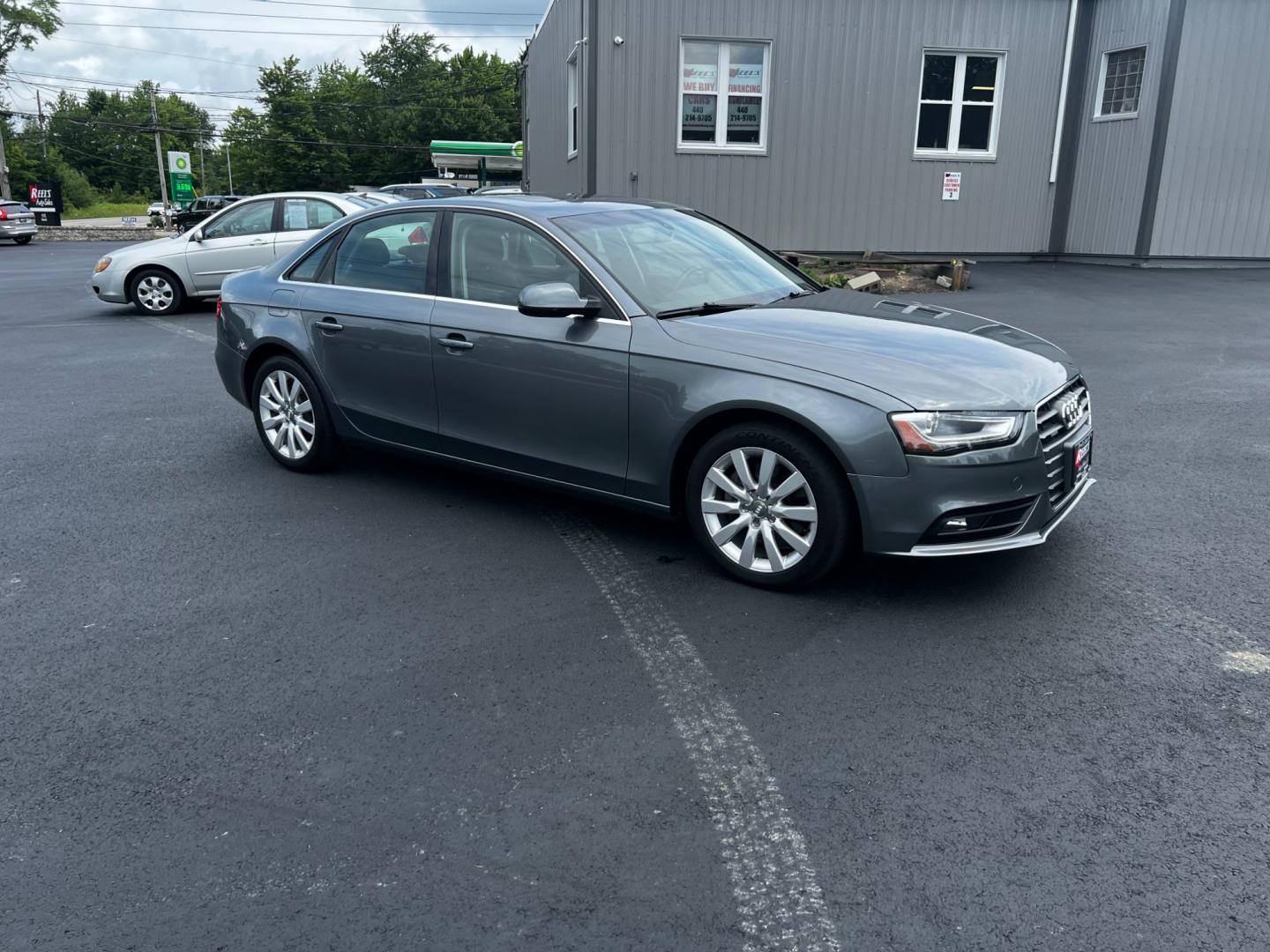 2013 Gray /Black Audi A4 2.0T Premium Sedan quattro (WAUBFAFL0DN) with an 2.0L I4 DOHC 16V TURBO engine, 8-Speed Automatic transmission, located at 11115 Chardon Rd. , Chardon, OH, 44024, (440) 214-9705, 41.580246, -81.241943 - This 2013 Audi A4 Premium Quattro is a refined luxury sedan that combines performance, comfort, and efficiency. It features a 2.0-liter turbocharged four-cylinder engine paired with an 8-speed automatic transmission and Audi's renowned Quattro all-wheel drive system. The A4 offers a blend of luxury - Photo#3