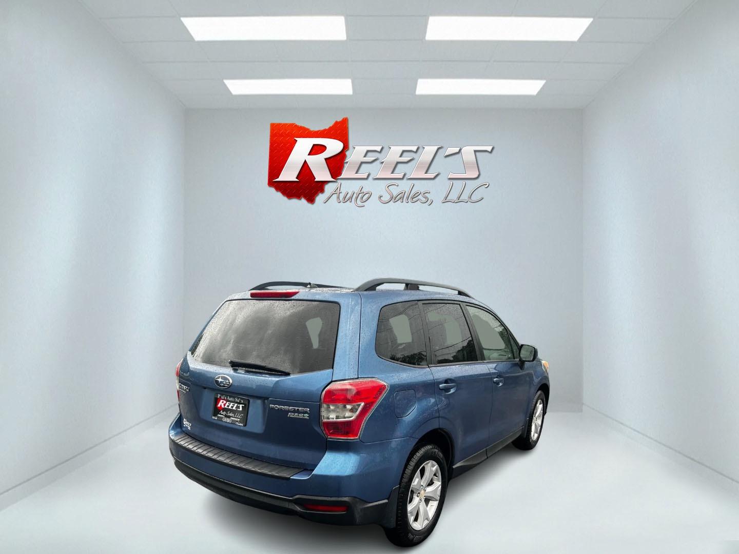 2015 Blue /Gray Subaru Forester 2.5i Premium (JF2SJADC1FH) with an 2.5L H4 SOHC 16V engine, Automatic transmission, located at 11115 Chardon Rd. , Chardon, OH, 44024, (440) 214-9705, 41.580246, -81.241943 - Photo#5