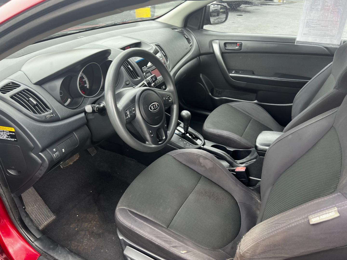 2010 Red /Black Kia Forte Koup EX (KNAFU6A29A5) with an 2.0L I4 DOHC 16V engine, 4 Speed Auto transmission, located at 547 E. Main St., Orwell, OH, 44076, (440) 437-5893, 41.535435, -80.847855 - This 2010 Kia Forte Koup EX is a compact coupe that offers a blend of style, efficiency, and practicality. It's powered by a 2.0-liter inline-four engine paired with a 4-speed automatic transmission, providing adequate performance for daily driving. This Forte Koup stands out for its impressive fuel - Photo#14