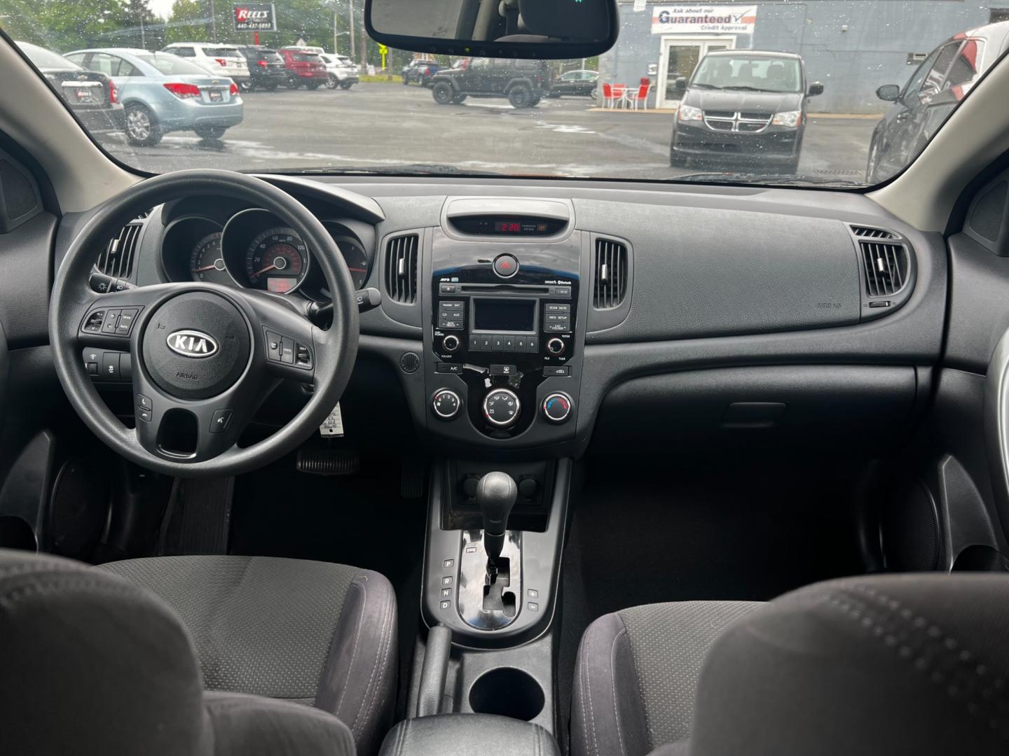 2010 Red /Black Kia Forte Koup EX (KNAFU6A29A5) with an 2.0L I4 DOHC 16V engine, 4 Speed Auto transmission, located at 547 E. Main St., Orwell, OH, 44076, (440) 437-5893, 41.535435, -80.847855 - This 2010 Kia Forte Koup EX is a compact coupe that offers a blend of style, efficiency, and practicality. It's powered by a 2.0-liter inline-four engine paired with a 4-speed automatic transmission, providing adequate performance for daily driving. This Forte Koup stands out for its impressive fuel - Photo#25