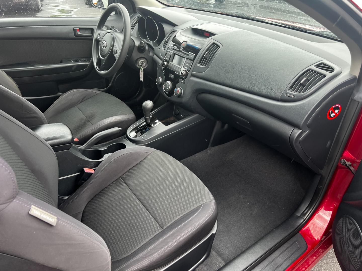 2010 Red /Black Kia Forte Koup EX (KNAFU6A29A5) with an 2.0L I4 DOHC 16V engine, 4 Speed Auto transmission, located at 547 E. Main St., Orwell, OH, 44076, (440) 437-5893, 41.535435, -80.847855 - This 2010 Kia Forte Koup EX is a compact coupe that offers a blend of style, efficiency, and practicality. It's powered by a 2.0-liter inline-four engine paired with a 4-speed automatic transmission, providing adequate performance for daily driving. This Forte Koup stands out for its impressive fuel - Photo#27