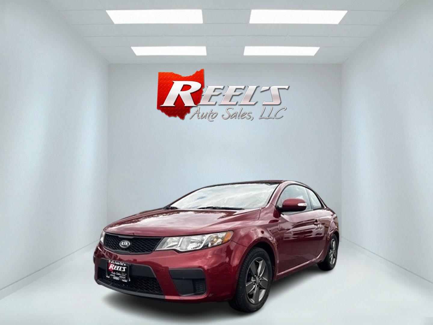 2010 Red /Black Kia Forte Koup EX (KNAFU6A29A5) with an 2.0L I4 DOHC 16V engine, 4 Speed Auto transmission, located at 547 E. Main St., Orwell, OH, 44076, (440) 437-5893, 41.535435, -80.847855 - This 2010 Kia Forte Koup EX is a compact coupe that offers a blend of style, efficiency, and practicality. It's powered by a 2.0-liter inline-four engine paired with a 4-speed automatic transmission, providing adequate performance for daily driving. This Forte Koup stands out for its impressive fuel - Photo#0