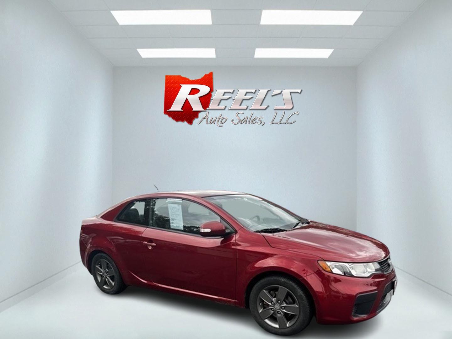 2010 Red /Black Kia Forte Koup EX (KNAFU6A29A5) with an 2.0L I4 DOHC 16V engine, 4 Speed Auto transmission, located at 547 E. Main St., Orwell, OH, 44076, (440) 437-5893, 41.535435, -80.847855 - This 2010 Kia Forte Koup EX is a compact coupe that offers a blend of style, efficiency, and practicality. It's powered by a 2.0-liter inline-four engine paired with a 4-speed automatic transmission, providing adequate performance for daily driving. This Forte Koup stands out for its impressive fuel - Photo#3