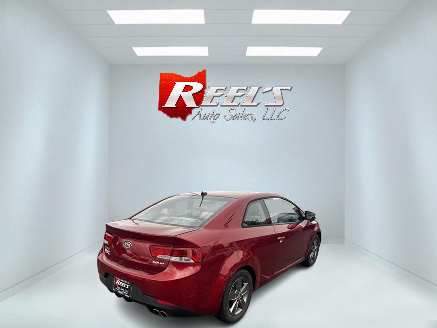 2010 Red /Black Kia Forte Koup EX (KNAFU6A29A5) with an 2.0L I4 DOHC 16V engine, 4 Speed Auto transmission, located at 547 E. Main St., Orwell, OH, 44076, (440) 437-5893, 41.535435, -80.847855 - This 2010 Kia Forte Koup EX is a compact coupe that offers a blend of style, efficiency, and practicality. It's powered by a 2.0-liter inline-four engine paired with a 4-speed automatic transmission, providing adequate performance for daily driving. This Forte Koup stands out for its impressive fuel - Photo#5