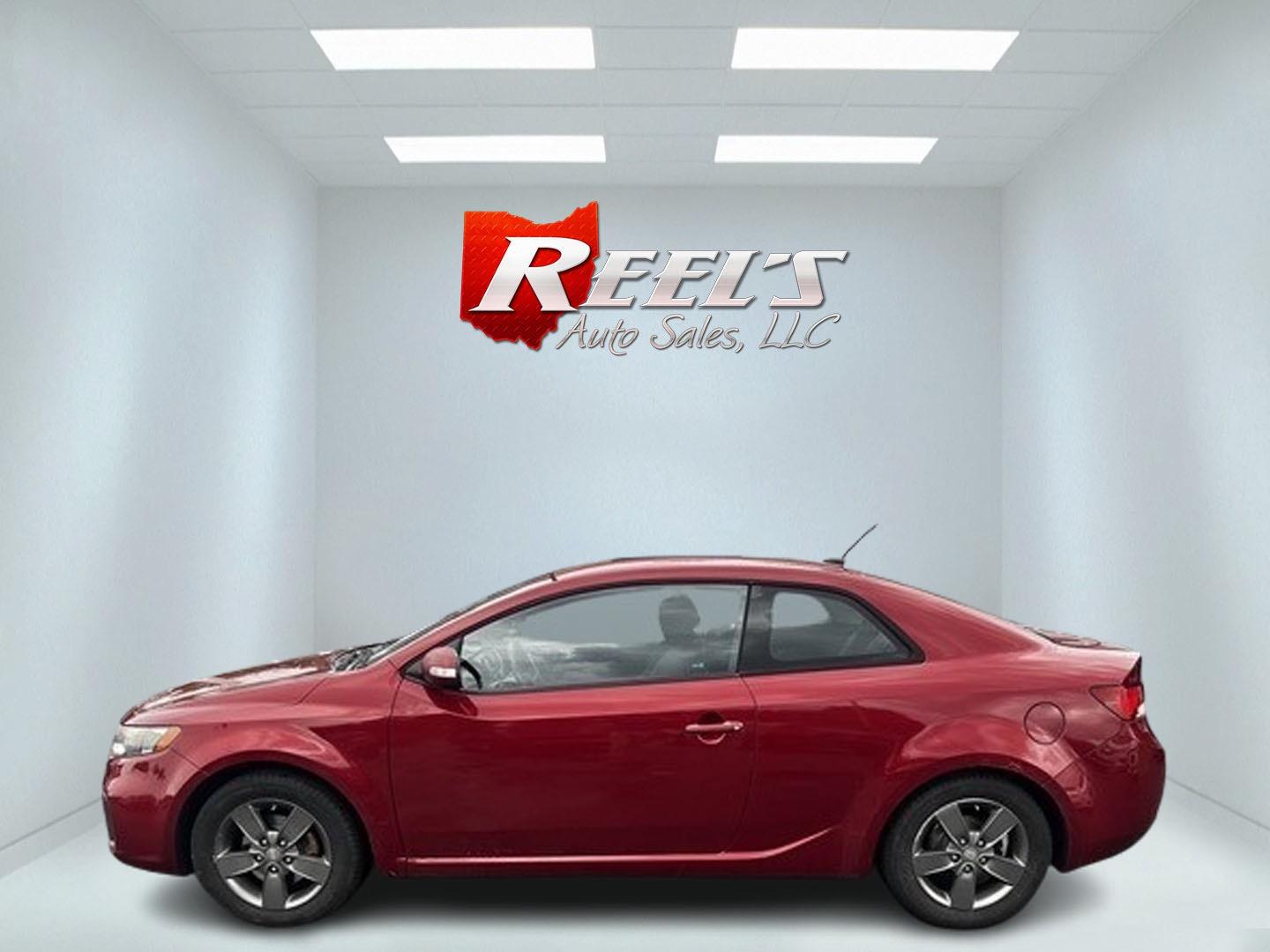 2010 Red /Black Kia Forte Koup EX (KNAFU6A29A5) with an 2.0L I4 DOHC 16V engine, 4 Speed Auto transmission, located at 547 E. Main St., Orwell, OH, 44076, (440) 437-5893, 41.535435, -80.847855 - This 2010 Kia Forte Koup EX is a compact coupe that offers a blend of style, efficiency, and practicality. It's powered by a 2.0-liter inline-four engine paired with a 4-speed automatic transmission, providing adequate performance for daily driving. This Forte Koup stands out for its impressive fuel - Photo#9