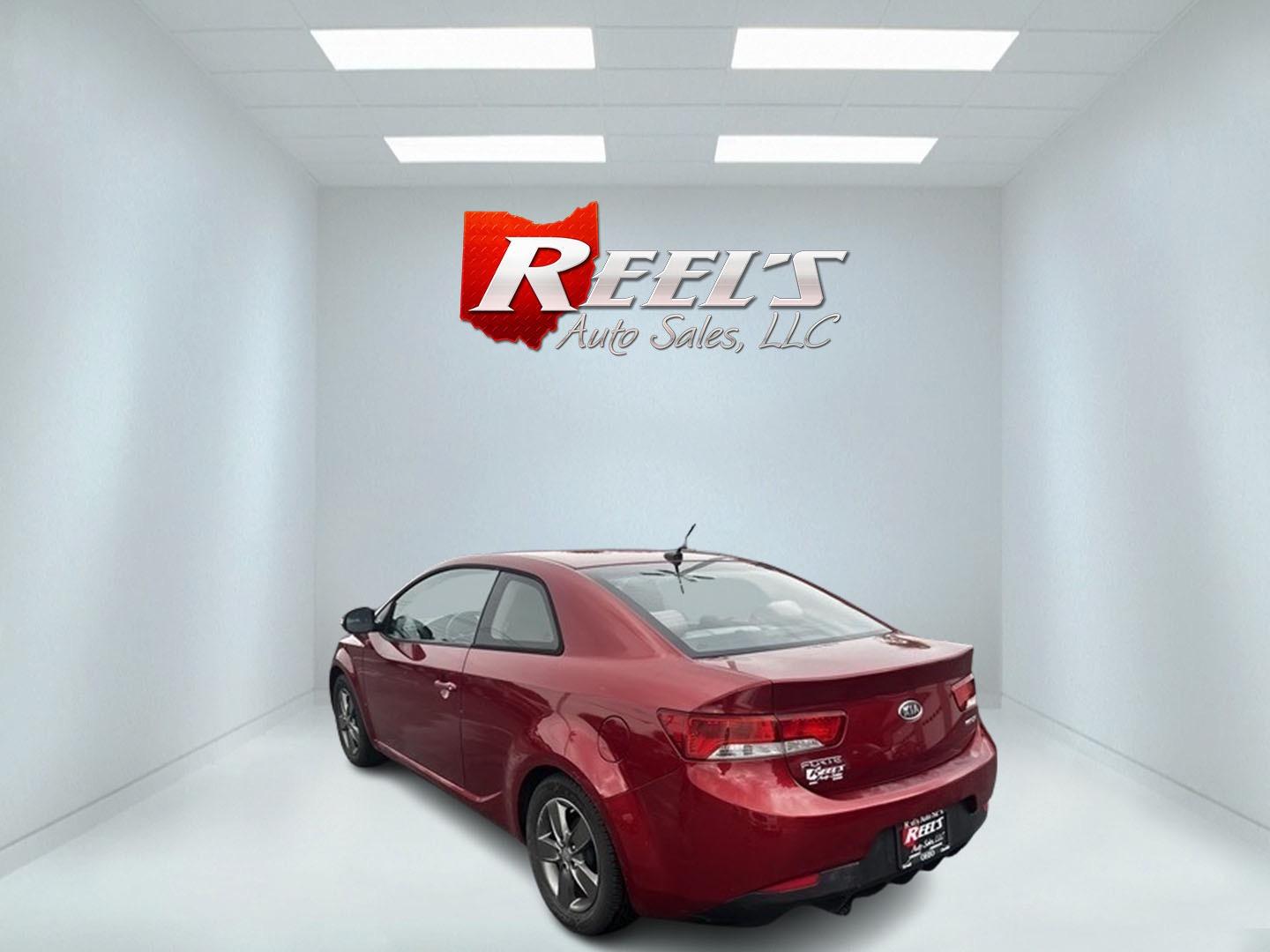 2010 Red /Black Kia Forte Koup EX (KNAFU6A29A5) with an 2.0L I4 DOHC 16V engine, 4 Speed Auto transmission, located at 547 E. Main St., Orwell, OH, 44076, (440) 437-5893, 41.535435, -80.847855 - This 2010 Kia Forte Koup EX is a compact coupe that offers a blend of style, efficiency, and practicality. It's powered by a 2.0-liter inline-four engine paired with a 4-speed automatic transmission, providing adequate performance for daily driving. This Forte Koup stands out for its impressive fuel - Photo#7