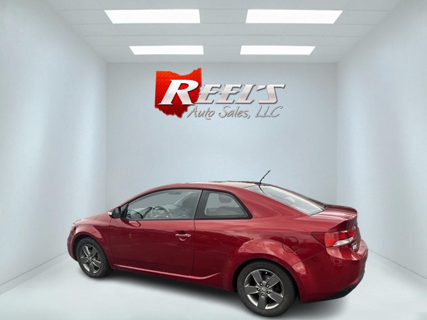 2010 Red /Black Kia Forte Koup EX (KNAFU6A29A5) with an 2.0L I4 DOHC 16V engine, 4 Speed Auto transmission, located at 547 E. Main St., Orwell, OH, 44076, (440) 437-5893, 41.535435, -80.847855 - This 2010 Kia Forte Koup EX is a compact coupe that offers a blend of style, efficiency, and practicality. It's powered by a 2.0-liter inline-four engine paired with a 4-speed automatic transmission, providing adequate performance for daily driving. This Forte Koup stands out for its impressive fuel - Photo#8