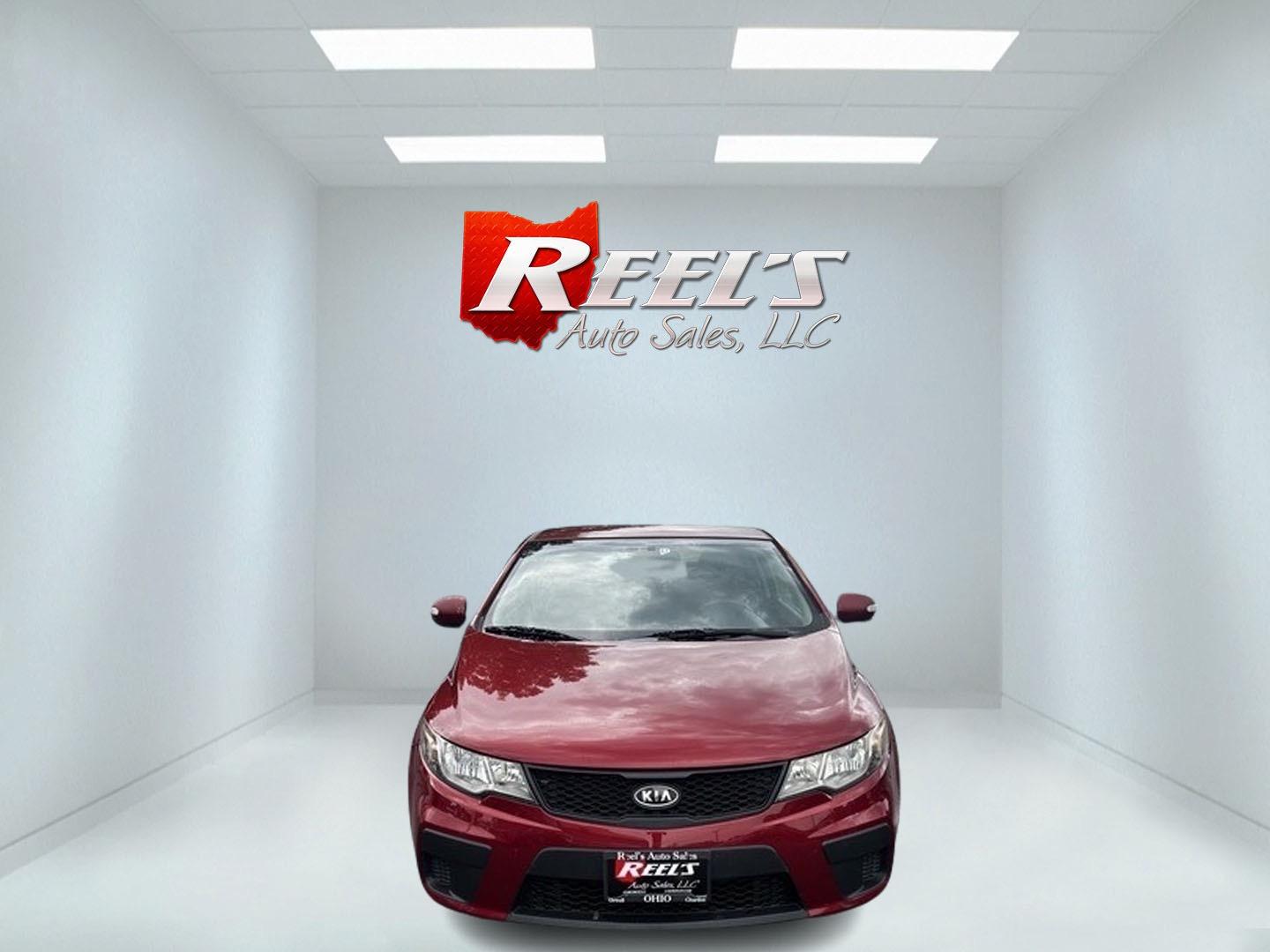 2010 Red /Black Kia Forte Koup EX (KNAFU6A29A5) with an 2.0L I4 DOHC 16V engine, 4 Speed Auto transmission, located at 547 E. Main St., Orwell, OH, 44076, (440) 437-5893, 41.535435, -80.847855 - This 2010 Kia Forte Koup EX is a compact coupe that offers a blend of style, efficiency, and practicality. It's powered by a 2.0-liter inline-four engine paired with a 4-speed automatic transmission, providing adequate performance for daily driving. This Forte Koup stands out for its impressive fuel - Photo#1