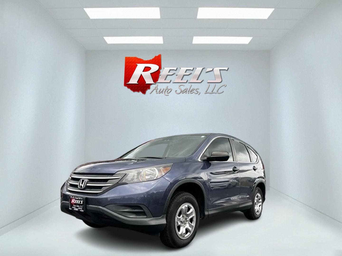 2013 Blue /Gray Honda CR-V LX 4WD 5-Speed AT (2HKRM4H35DH) with an 2.4L I4 DOHC 16V engine, 5-Speed Automatic transmission, located at 547 E. Main St., Orwell, OH, 44076, (440) 437-5893, 41.535435, -80.847855 - This 2013 Honda CR-V LX 4WD is a reliable and practical compact SUV that offers a good balance of efficiency and capability. It's powered by a 2.4-liter inline-four engine paired with a 5-speed automatic transmission, providing adequate performance for daily driving and light off-road use. The 4WD s - Photo#0