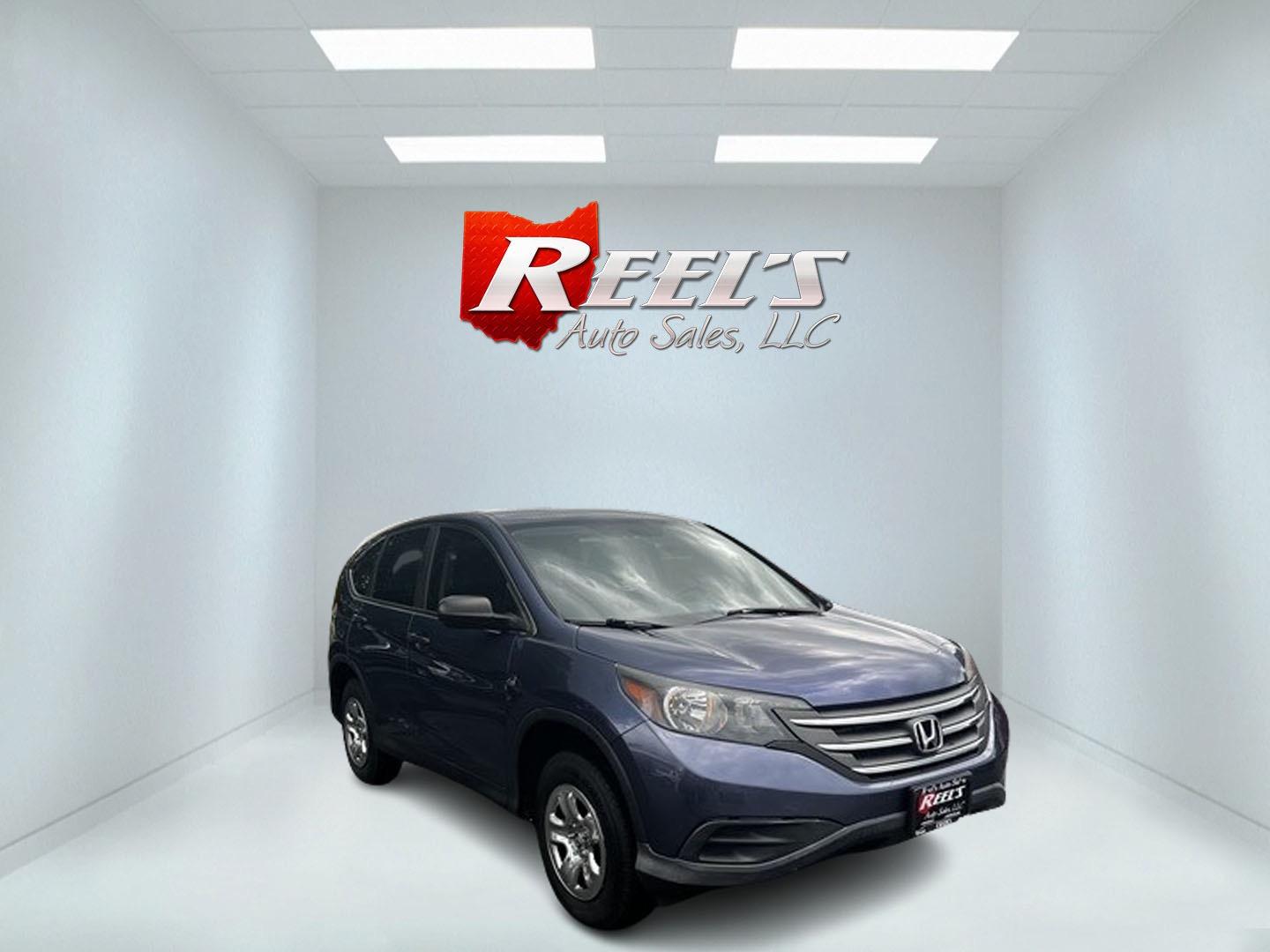 2013 Blue /Gray Honda CR-V LX 4WD 5-Speed AT (2HKRM4H35DH) with an 2.4L I4 DOHC 16V engine, 5-Speed Automatic transmission, located at 547 E. Main St., Orwell, OH, 44076, (440) 437-5893, 41.535435, -80.847855 - This 2013 Honda CR-V LX 4WD is a reliable and practical compact SUV that offers a good balance of efficiency and capability. It's powered by a 2.4-liter inline-four engine paired with a 5-speed automatic transmission, providing adequate performance for daily driving and light off-road use. The 4WD s - Photo#2