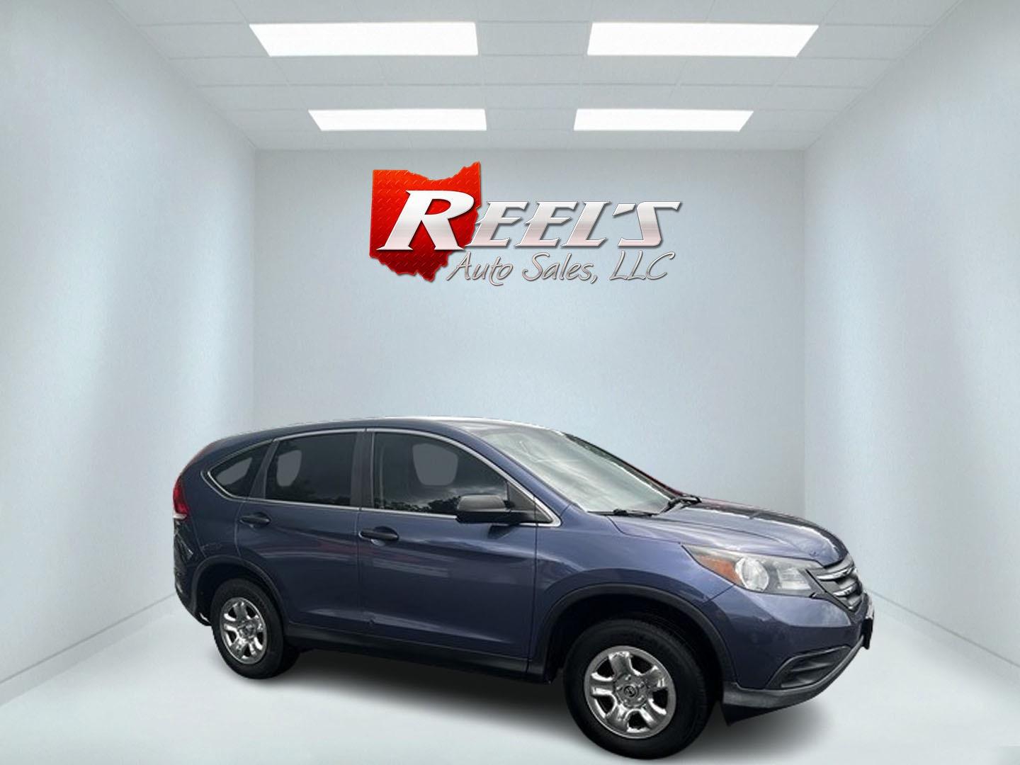 2013 Blue /Gray Honda CR-V LX 4WD 5-Speed AT (2HKRM4H35DH) with an 2.4L I4 DOHC 16V engine, 5-Speed Automatic transmission, located at 547 E. Main St., Orwell, OH, 44076, (440) 437-5893, 41.535435, -80.847855 - This 2013 Honda CR-V LX 4WD is a reliable and practical compact SUV that offers a good balance of efficiency and capability. It's powered by a 2.4-liter inline-four engine paired with a 5-speed automatic transmission, providing adequate performance for daily driving and light off-road use. The 4WD s - Photo#3