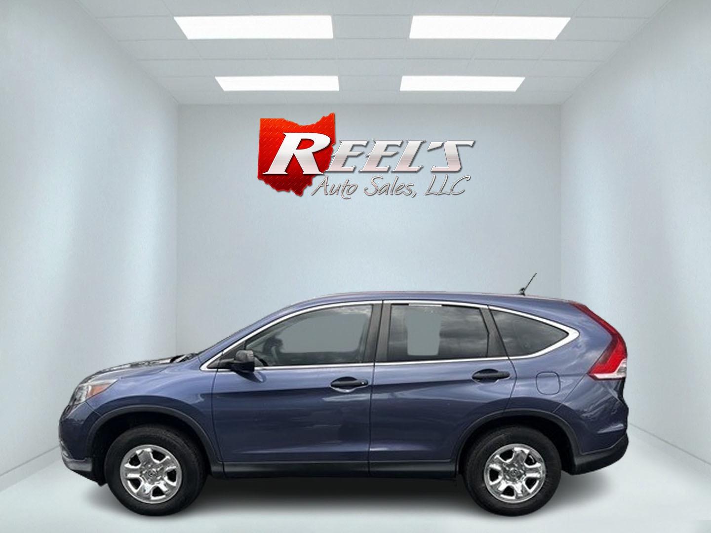 2013 Blue /Gray Honda CR-V LX 4WD 5-Speed AT (2HKRM4H35DH) with an 2.4L I4 DOHC 16V engine, 5-Speed Automatic transmission, located at 547 E. Main St., Orwell, OH, 44076, (440) 437-5893, 41.535435, -80.847855 - This 2013 Honda CR-V LX 4WD is a reliable and practical compact SUV that offers a good balance of efficiency and capability. It's powered by a 2.4-liter inline-four engine paired with a 5-speed automatic transmission, providing adequate performance for daily driving and light off-road use. The 4WD s - Photo#8