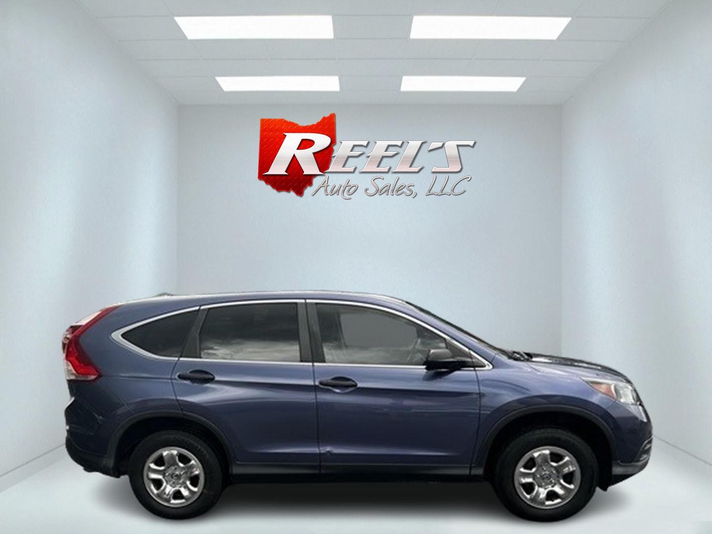 2013 Blue /Gray Honda CR-V LX 4WD 5-Speed AT (2HKRM4H35DH) with an 2.4L I4 DOHC 16V engine, 5-Speed Automatic transmission, located at 547 E. Main St., Orwell, OH, 44076, (440) 437-5893, 41.535435, -80.847855 - This 2013 Honda CR-V LX 4WD is a reliable and practical compact SUV that offers a good balance of efficiency and capability. It's powered by a 2.4-liter inline-four engine paired with a 5-speed automatic transmission, providing adequate performance for daily driving and light off-road use. The 4WD s - Photo#4