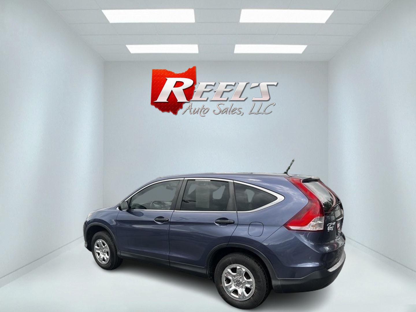 2013 Blue /Gray Honda CR-V LX 4WD 5-Speed AT (2HKRM4H35DH) with an 2.4L I4 DOHC 16V engine, 5-Speed Automatic transmission, located at 547 E. Main St., Orwell, OH, 44076, (440) 437-5893, 41.535435, -80.847855 - This 2013 Honda CR-V LX 4WD is a reliable and practical compact SUV that offers a good balance of efficiency and capability. It's powered by a 2.4-liter inline-four engine paired with a 5-speed automatic transmission, providing adequate performance for daily driving and light off-road use. The 4WD s - Photo#7