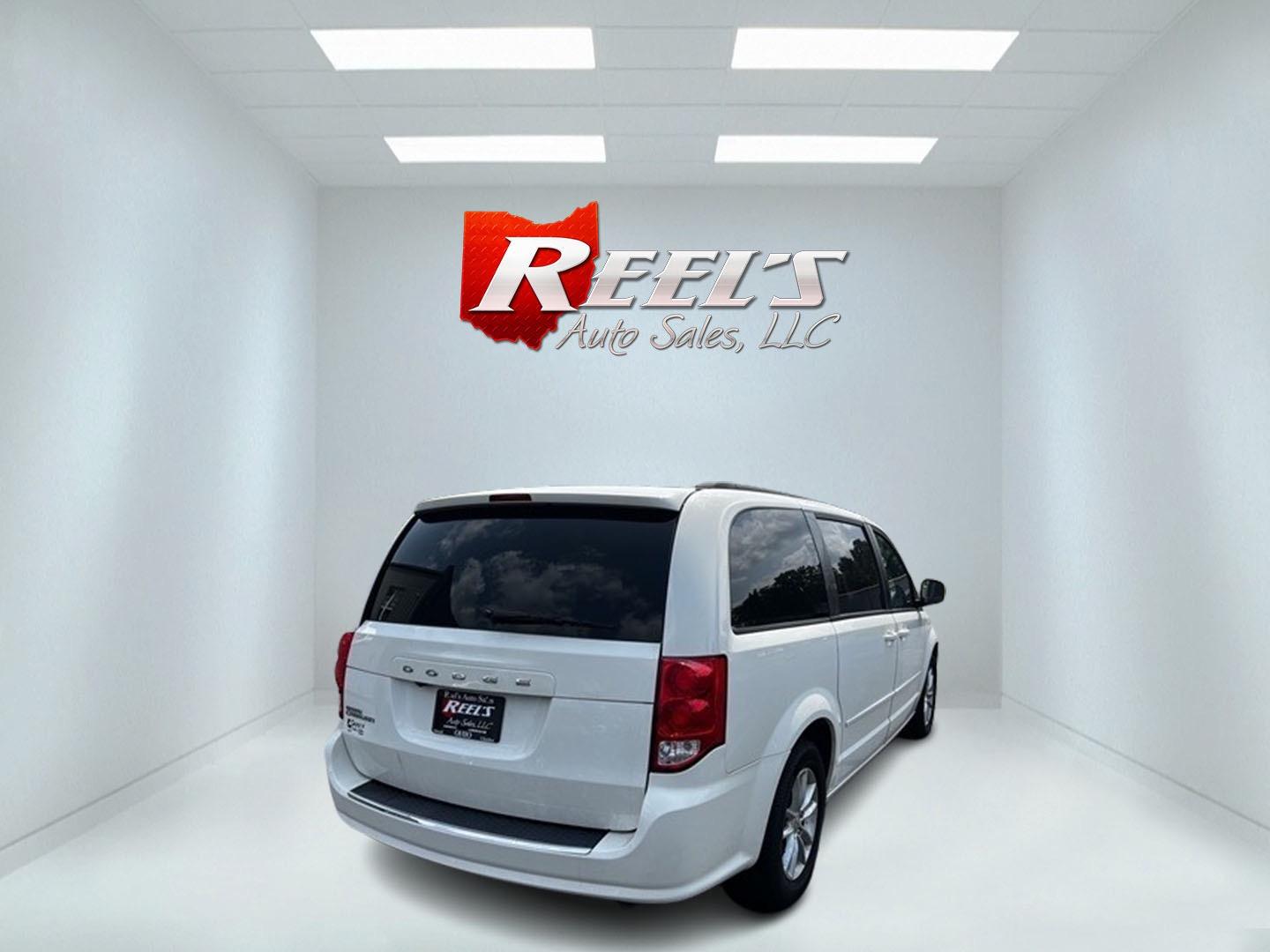 2013 White /Black Dodge Grand Caravan SXT (2C4RDGCG0DR) with an 3.6L V6 DOHC 24V FFV engine, 6-Speed Automatic transmission, located at 547 E. Main St., Orwell, OH, 44076, (440) 437-5893, 41.535435, -80.847855 - Photo#4