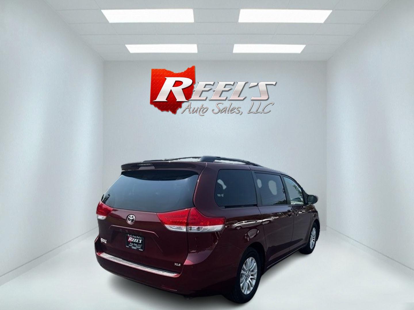 2014 Red /Tan Toyota Sienna (5TDYK3DC2ES) , located at 11115 Chardon Rd. , Chardon, OH, 44024, (440) 214-9705, 41.580246, -81.241943 - This 2014 Toyota Sienna XLE is a versatile and family-friendly minivan equipped with a range of convenience and comfort features. It's powered by a 3.5-liter V6 engine paired with a 6-speed automatic transmission, providing balanced performance for its class. This vehicle's interior comes with a lea - Photo#5