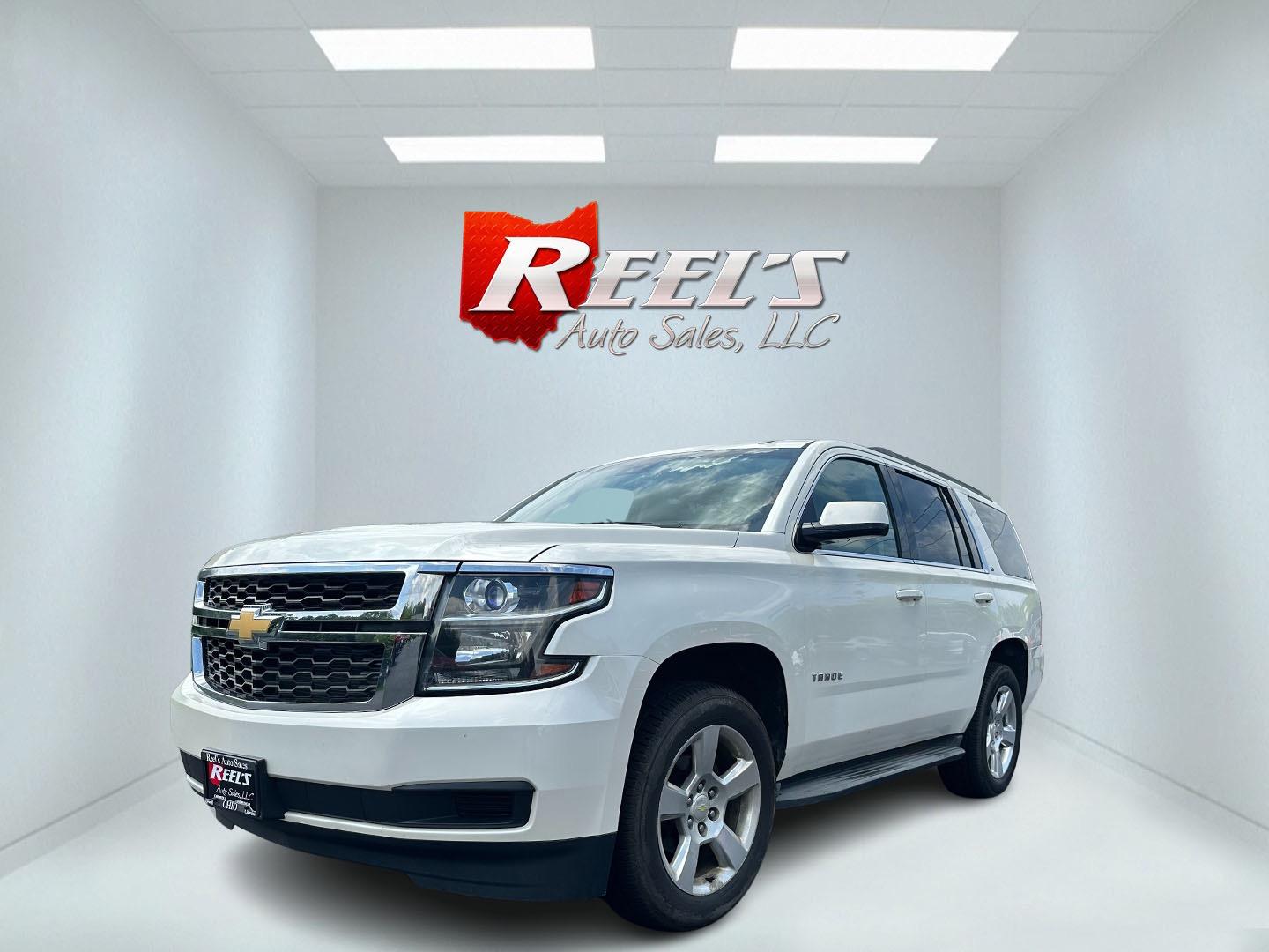 2015 White /Brown Chevrolet Tahoe LT 4WD (1GNSKBKC8FR) with an 5.3L V8 OHV 16V engine, 6-Speed Automatic transmission, located at 11115 Chardon Rd. , Chardon, OH, 44024, (440) 214-9705, 41.580246, -81.241943 - This 2015 Chevrolet Tahoe LT 4WD is a well-equipped full-size SUV that offers a blend of power, comfort, and advanced safety features. It's powered by a robust 5.3-liter Vortec V8 engine producing 355 horsepower and 383 lb-ft of torque, paired with a 6-speed automatic transmission. The 4WD system an - Photo#0