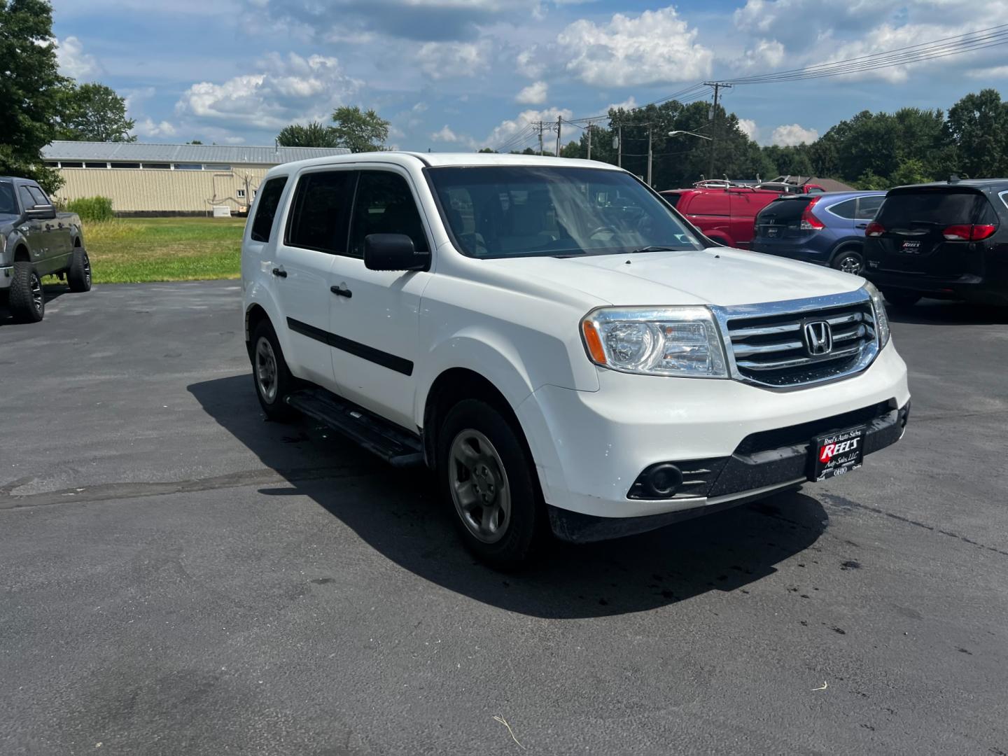 2012 White /Gray Honda Pilot LX 4WD 5-Spd AT (5FNYF4H29CB) with an 3.5L V6 SOHC 24V engine, 5-Speed Automatic transmission, located at 547 E. Main St., Orwell, OH, 44076, (440) 437-5893, 41.535435, -80.847855 - This 2012 Honda Pilot LX 4WD is a midsize SUV that offers reliable performance and numerous convenience features. It is powered by a 3.5 SOHC V6 engine coupled with a 5-speed automatic transmission. The SUV can tow up to 4,500 pounds, offering the VTM-4 lock system for better handling and traction. - Photo#12