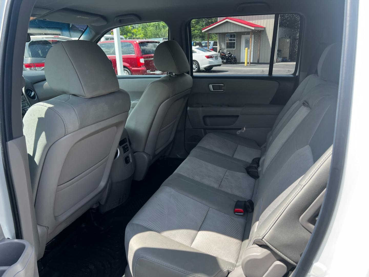 2012 White /Gray Honda Pilot LX 4WD 5-Spd AT (5FNYF4H29CB) with an 3.5L V6 SOHC 24V engine, 5-Speed Automatic transmission, located at 547 E. Main St., Orwell, OH, 44076, (440) 437-5893, 41.535435, -80.847855 - This 2012 Honda Pilot LX 4WD is a midsize SUV that offers reliable performance and numerous convenience features. It is powered by a 3.5 SOHC V6 engine coupled with a 5-speed automatic transmission. The SUV can tow up to 4,500 pounds, offering the VTM-4 lock system for better handling and traction. - Photo#41