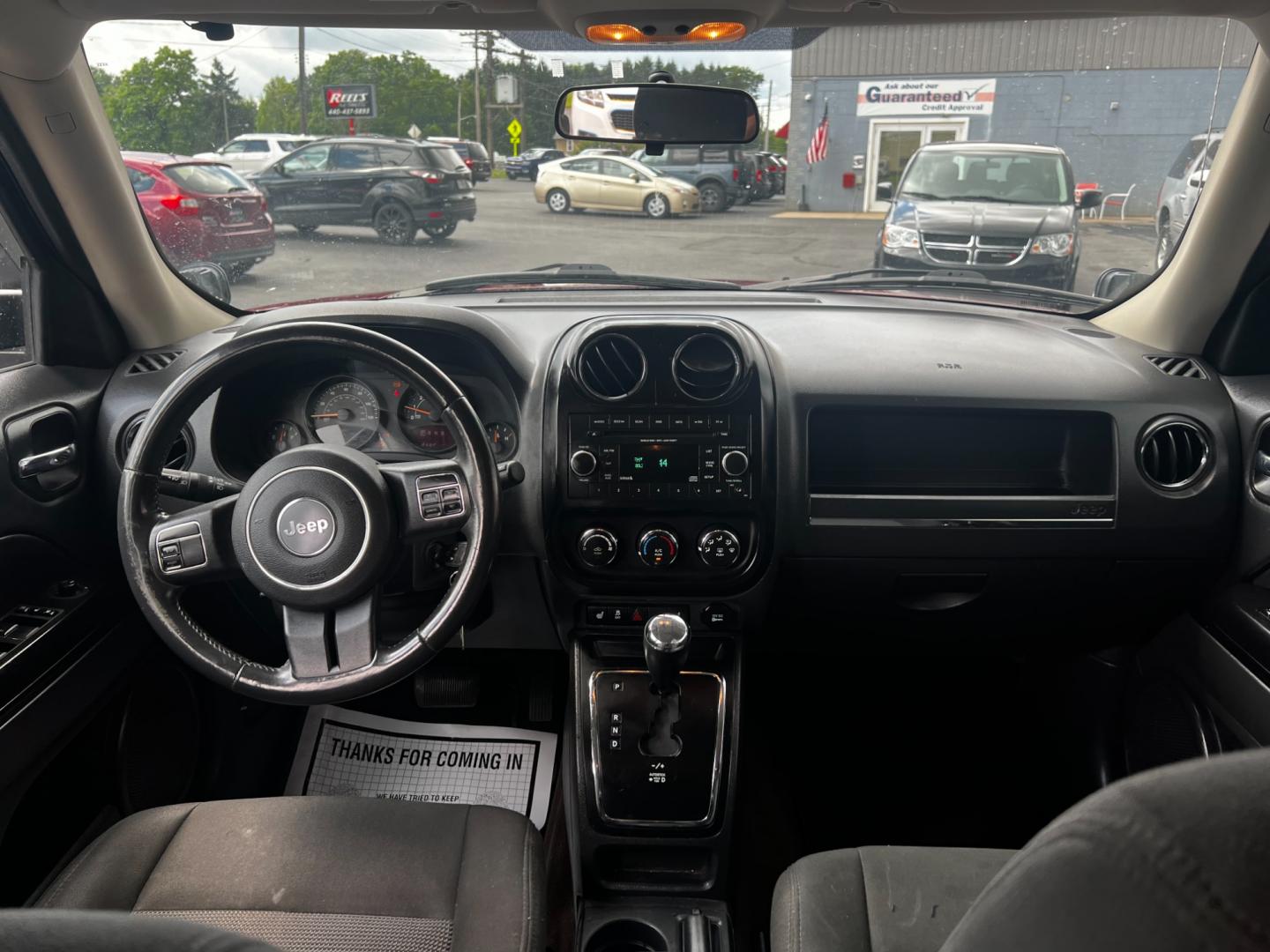 2014 Red /Black Jeep Patriot Latitude 4WD (1C4NJRFB2ED) with an 2.4L I4 DOHC 16V engine, 6 Speed Auto transmission, located at 547 E. Main St., Orwell, OH, 44076, (440) 437-5893, 41.535435, -80.847855 - Photo#26