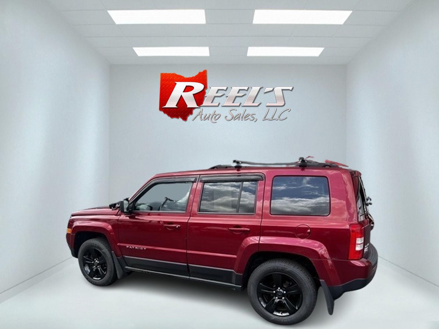 2014 Red /Black Jeep Patriot Latitude 4WD (1C4NJRFB2ED) with an 2.4L I4 DOHC 16V engine, 6 Speed Auto transmission, located at 547 E. Main St., Orwell, OH, 44076, (440) 437-5893, 41.535435, -80.847855 - Photo#7