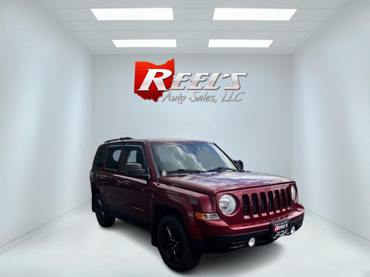 2014 Red /Black Jeep Patriot Latitude 4WD (1C4NJRFB2ED) with an 2.4L I4 DOHC 16V engine, 6 Speed Auto transmission, located at 547 E. Main St., Orwell, OH, 44076, (440) 437-5893, 41.535435, -80.847855 - This 2014 Jeep Patriot Latitude 4WD is a compact SUV that offers a balance of efficiency and off-road capability. It's equipped with a 2.4-liter inline-four engine paired with a 6-speed automatic transmission, providing adequate power for daily driving. The 4WD system includes a lock mode for enhanc - Photo#1