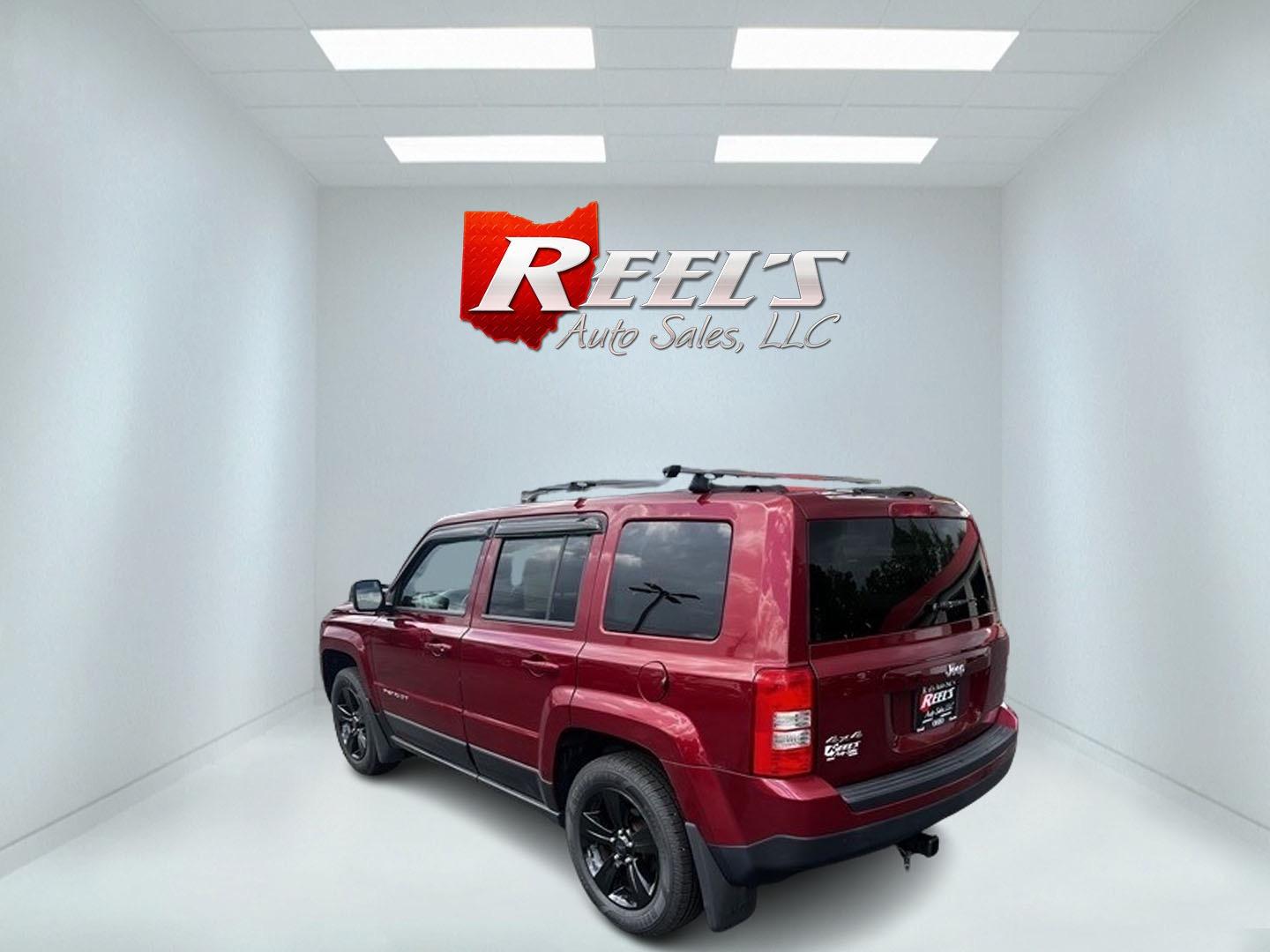 2014 Red /Black Jeep Patriot Latitude 4WD (1C4NJRFB2ED) with an 2.4L I4 DOHC 16V engine, 6 Speed Auto transmission, located at 547 E. Main St., Orwell, OH, 44076, (440) 437-5893, 41.535435, -80.847855 - Photo#6