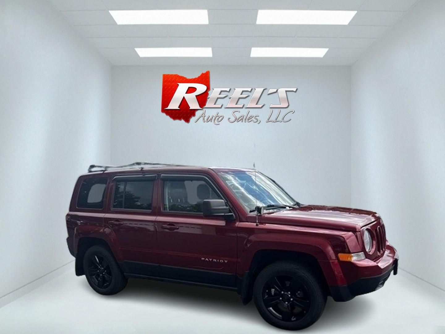 2014 Red /Black Jeep Patriot Latitude 4WD (1C4NJRFB2ED) with an 2.4L I4 DOHC 16V engine, 6 Speed Auto transmission, located at 547 E. Main St., Orwell, OH, 44076, (440) 437-5893, 41.535435, -80.847855 - Photo#2