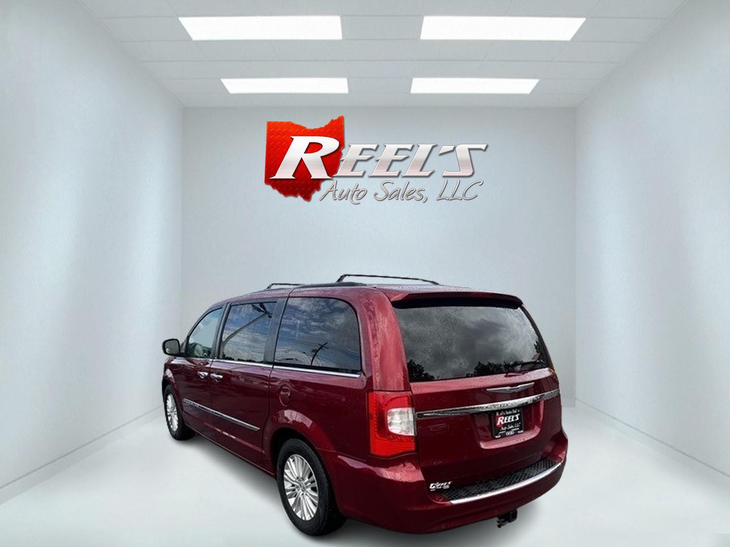 2013 Red /Black Chrysler Town & Country Touring-L (2C4RC1CG4DR) with an 3.6L V6 DOHC 24V FFV engine, 6-Speed Automatic transmission, located at 547 E. Main St., Orwell, OH, 44076, (440) 437-5893, 41.535435, -80.847855 - This 2013 Chrysler Town & Country Touring-L is a well-equipped minivan that offers a blend of luxury, convenience, and safety features. It's powered by a 3.6-liter Pentastar V6 engine paired with a 6-speed automatic transmission, and is flex-fuel capable. The luxurious interior boasts leather uphols - Photo#6