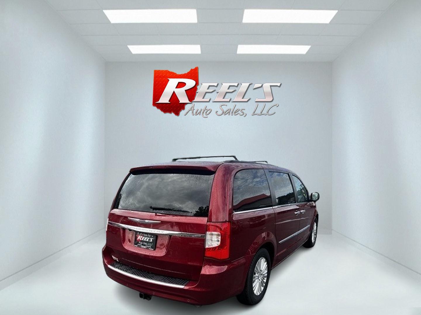 2013 Red /Black Chrysler Town & Country Touring-L (2C4RC1CG4DR) with an 3.6L V6 DOHC 24V FFV engine, 6-Speed Automatic transmission, located at 547 E. Main St., Orwell, OH, 44076, (440) 437-5893, 41.535435, -80.847855 - This 2013 Chrysler Town & Country Touring-L is a well-equipped minivan that offers a blend of luxury, convenience, and safety features. It's powered by a 3.6-liter Pentastar V6 engine paired with a 6-speed automatic transmission, and is flex-fuel capable. The luxurious interior boasts leather uphols - Photo#4