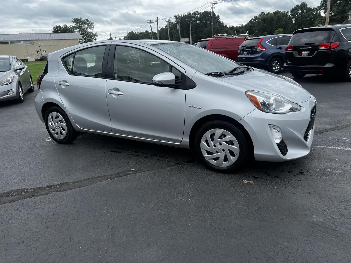 2016 Silver /Black Toyota Prius c Three (JTDKDTB32G1) with an 1.5L I4 DOHC 16V HYBRID engine, Automatic transmission, located at 547 E. Main St., Orwell, OH, 44076, (440) 437-5893, 41.535435, -80.847855 - This 2016 Toyota Prius C Three is a highly fuel-efficient compact hybrid, boasting an impressive 50 MPG combined rating. This eco-friendly model comes equipped with modern features including LED headlights and daytime running lights for improved visibility and energy efficiency. The interior feature - Photo#13