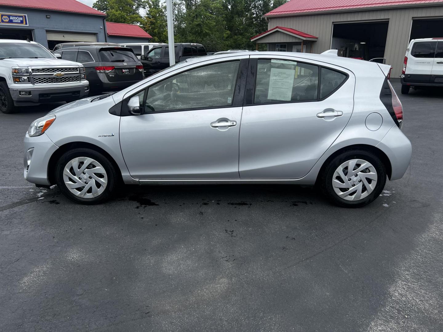 2016 Silver /Black Toyota Prius c Three (JTDKDTB32G1) with an 1.5L I4 DOHC 16V HYBRID engine, Automatic transmission, located at 547 E. Main St., Orwell, OH, 44076, (440) 437-5893, 41.535435, -80.847855 - This 2016 Toyota Prius C Three is a highly fuel-efficient compact hybrid, boasting an impressive 50 MPG combined rating. This eco-friendly model comes equipped with modern features including LED headlights and daytime running lights for improved visibility and energy efficiency. The interior feature - Photo#26