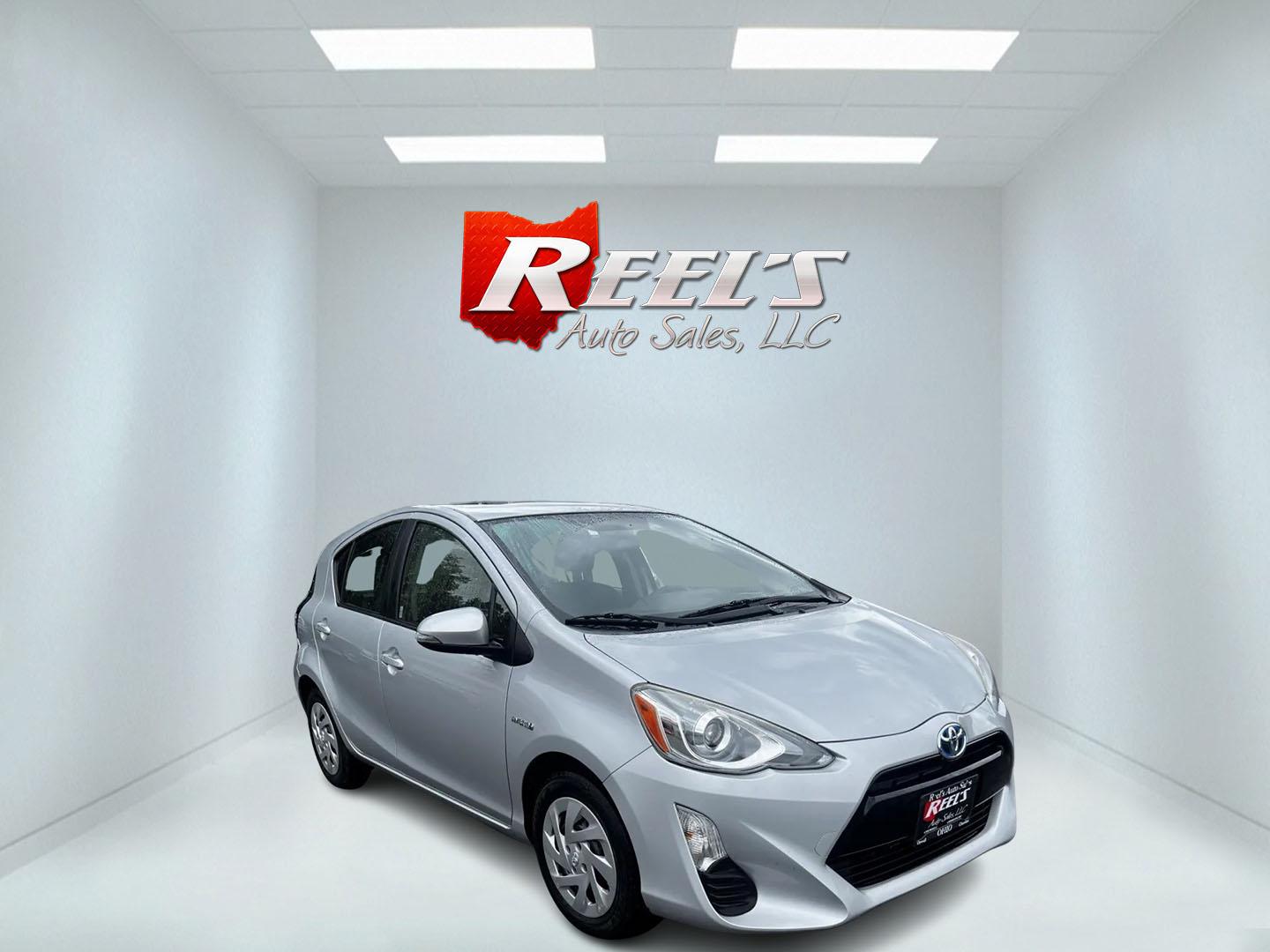 2016 Silver /Black Toyota Prius c Three (JTDKDTB32G1) with an 1.5L I4 DOHC 16V HYBRID engine, Automatic transmission, located at 547 E. Main St., Orwell, OH, 44076, (440) 437-5893, 41.535435, -80.847855 - This 2016 Toyota Prius C Three is a highly fuel-efficient compact hybrid, boasting an impressive 50 MPG combined rating. This eco-friendly model comes equipped with modern features including LED headlights and daytime running lights for improved visibility and energy efficiency. The interior feature - Photo#2