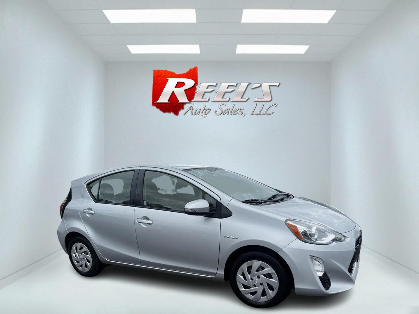 2016 Silver /Black Toyota Prius c Three (JTDKDTB32G1) with an 1.5L I4 DOHC 16V HYBRID engine, Automatic transmission, located at 547 E. Main St., Orwell, OH, 44076, (440) 437-5893, 41.535435, -80.847855 - This 2016 Toyota Prius C Three is a highly fuel-efficient compact hybrid, boasting an impressive 50 MPG combined rating. This eco-friendly model comes equipped with modern features including LED headlights and daytime running lights for improved visibility and energy efficiency. The interior feature - Photo#3