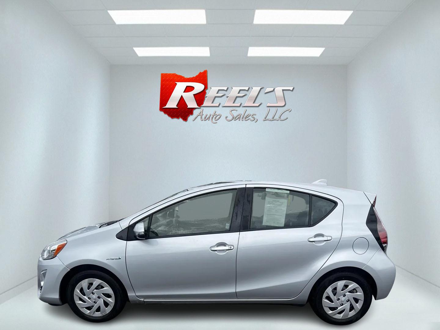 2016 Silver /Black Toyota Prius c Three (JTDKDTB32G1) with an 1.5L I4 DOHC 16V HYBRID engine, Automatic transmission, located at 547 E. Main St., Orwell, OH, 44076, (440) 437-5893, 41.535435, -80.847855 - This 2016 Toyota Prius C Three is a highly fuel-efficient compact hybrid, boasting an impressive 50 MPG combined rating. This eco-friendly model comes equipped with modern features including LED headlights and daytime running lights for improved visibility and energy efficiency. The interior feature - Photo#9