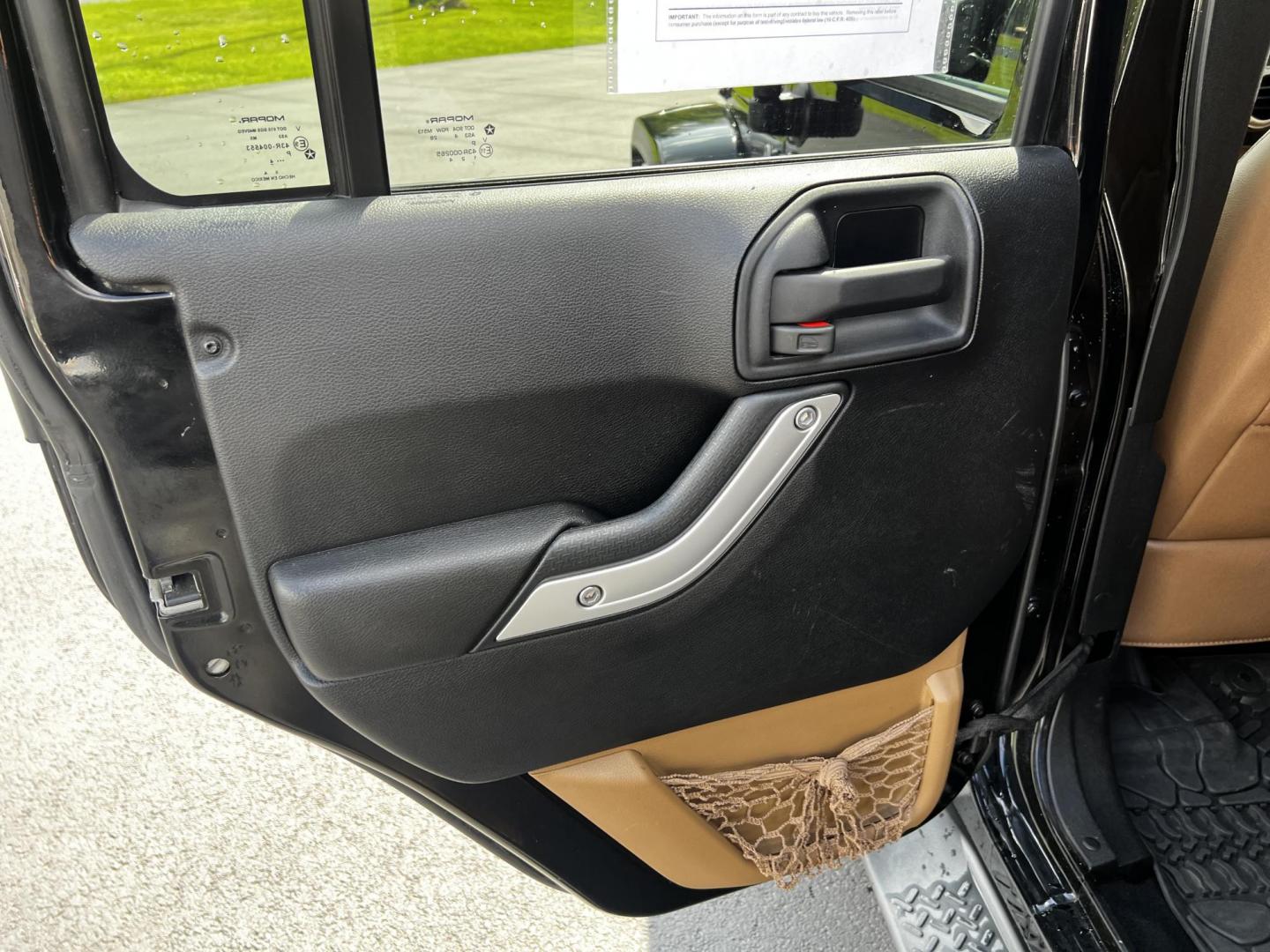 2015 Black /Brown Jeep Wrangler Unlimited Sahara 4WD (1C4BJWEG1FL) with an 3.6L V6 DOHC 24V engine, 5 Speed Auto transmission, located at 11115 Chardon Rd. , Chardon, OH, 44024, (440) 214-9705, 41.580246, -81.241943 - This 2015 Jeep Wrangler Unlimited Sahara is designed for both rugged adventures and urban comfort, powered by a 3.6-liter Pentastar V6 engine paired with a 5-speed automatic transmission. Its trail-rated capability is complemented by Dana 30 front and Dana 44 rear axles, making it well-suited for of - Photo#30