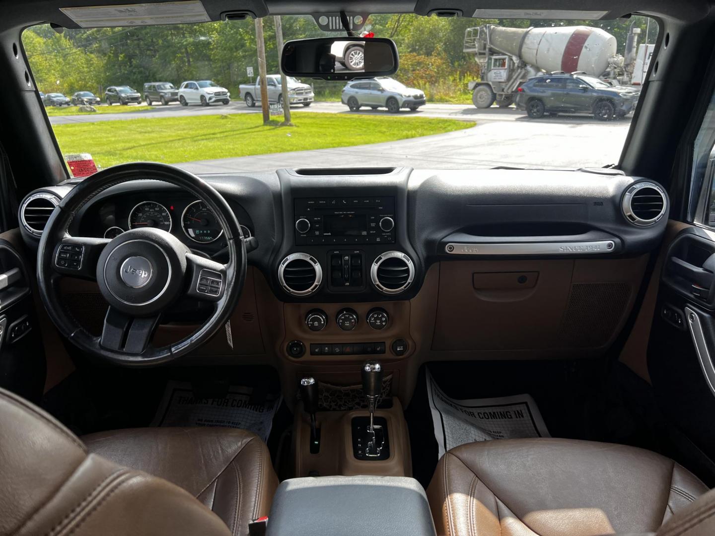 2015 Black /Brown Jeep Wrangler Unlimited Sahara 4WD (1C4BJWEG1FL) with an 3.6L V6 DOHC 24V engine, 5 Speed Auto transmission, located at 11115 Chardon Rd. , Chardon, OH, 44024, (440) 214-9705, 41.580246, -81.241943 - This 2015 Jeep Wrangler Unlimited Sahara is designed for both rugged adventures and urban comfort, powered by a 3.6-liter Pentastar V6 engine paired with a 5-speed automatic transmission. Its trail-rated capability is complemented by Dana 30 front and Dana 44 rear axles, making it well-suited for of - Photo#32