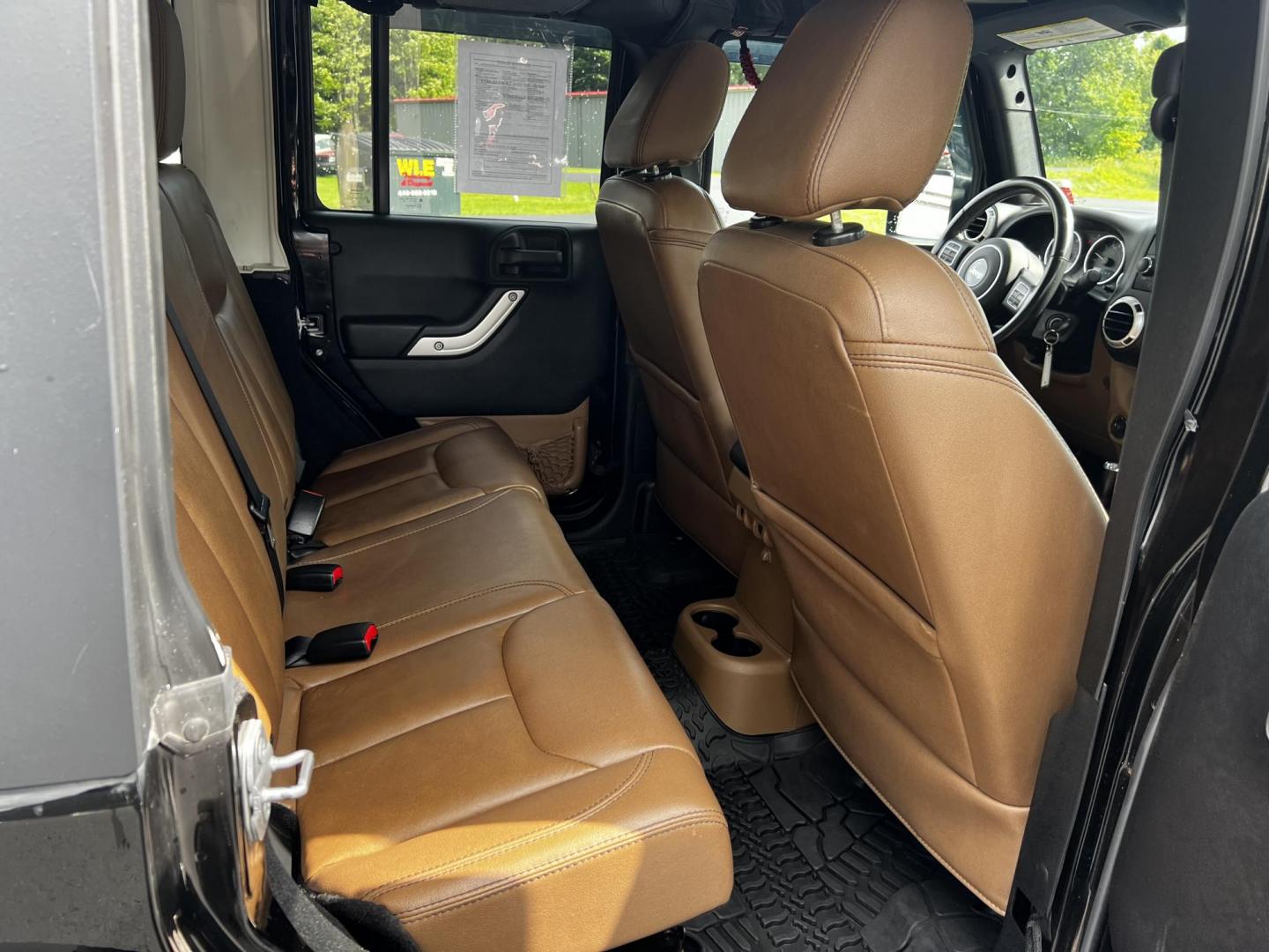 2015 Black /Brown Jeep Wrangler Unlimited Sahara 4WD (1C4BJWEG1FL) with an 3.6L V6 DOHC 24V engine, 5 Speed Auto transmission, located at 11115 Chardon Rd. , Chardon, OH, 44024, (440) 214-9705, 41.580246, -81.241943 - This 2015 Jeep Wrangler Unlimited Sahara is designed for both rugged adventures and urban comfort, powered by a 3.6-liter Pentastar V6 engine paired with a 5-speed automatic transmission. Its trail-rated capability is complemented by Dana 30 front and Dana 44 rear axles, making it well-suited for of - Photo#36