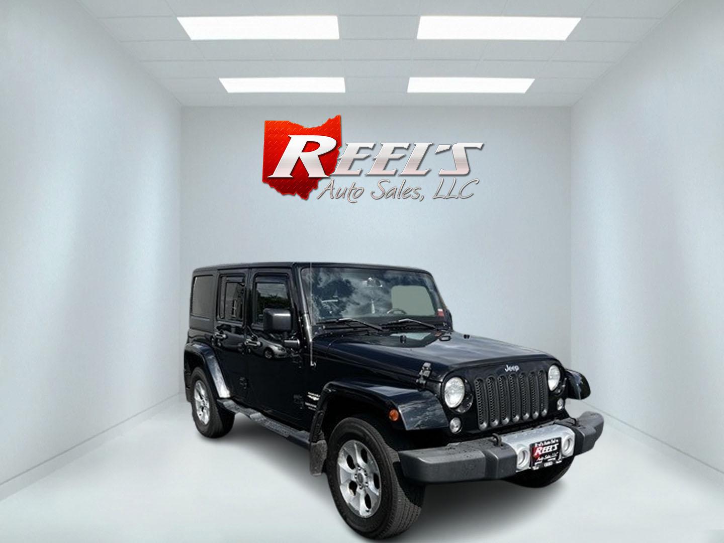 2015 Black /Brown Jeep Wrangler Unlimited Sahara 4WD (1C4BJWEG1FL) with an 3.6L V6 DOHC 24V engine, 5 Speed Auto transmission, located at 11115 Chardon Rd. , Chardon, OH, 44024, (440) 214-9705, 41.580246, -81.241943 - This 2015 Jeep Wrangler Unlimited Sahara is designed for both rugged adventures and urban comfort, powered by a 3.6-liter Pentastar V6 engine paired with a 5-speed automatic transmission. Its trail-rated capability is complemented by Dana 30 front and Dana 44 rear axles, making it well-suited for of - Photo#2