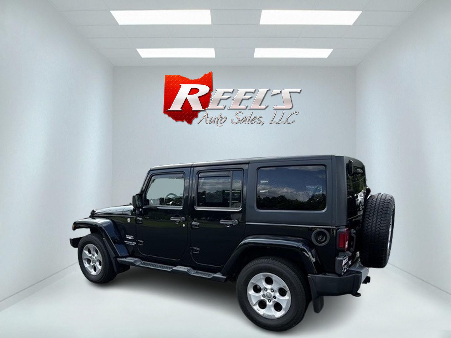 2015 Black /Brown Jeep Wrangler Unlimited Sahara 4WD (1C4BJWEG1FL) with an 3.6L V6 DOHC 24V engine, 5 Speed Auto transmission, located at 11115 Chardon Rd. , Chardon, OH, 44024, (440) 214-9705, 41.580246, -81.241943 - This 2015 Jeep Wrangler Unlimited Sahara is designed for both rugged adventures and urban comfort, powered by a 3.6-liter Pentastar V6 engine paired with a 5-speed automatic transmission. Its trail-rated capability is complemented by Dana 30 front and Dana 44 rear axles, making it well-suited for of - Photo#8