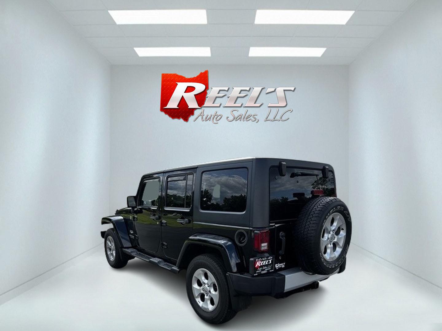 2015 Black /Brown Jeep Wrangler Unlimited Sahara 4WD (1C4BJWEG1FL) with an 3.6L V6 DOHC 24V engine, 5 Speed Auto transmission, located at 11115 Chardon Rd. , Chardon, OH, 44024, (440) 214-9705, 41.580246, -81.241943 - This 2015 Jeep Wrangler Unlimited Sahara is designed for both rugged adventures and urban comfort, powered by a 3.6-liter Pentastar V6 engine paired with a 5-speed automatic transmission. Its trail-rated capability is complemented by Dana 30 front and Dana 44 rear axles, making it well-suited for of - Photo#7