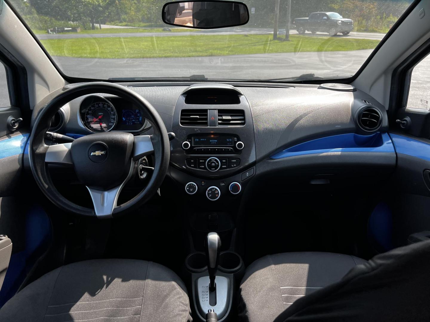 2014 Blue /Black Chevrolet Spark LS Auto (KL8CB6S9XEC) with an 1.2L I4 16V DOHC engine, Automatic transmission, located at 11115 Chardon Rd. , Chardon, OH, 44024, (440) 214-9705, 41.580246, -81.241943 - This 2014 Chevrolet Spark LS is a compact hatchback equipped with a 1.2 I4 engine and a CVT transmission, designed to offer efficiency and practicality for urban driving. It features daytime running lights and dusk-sensing headlights for improved visibility and safety. The Spark delivers a respectab - Photo#32