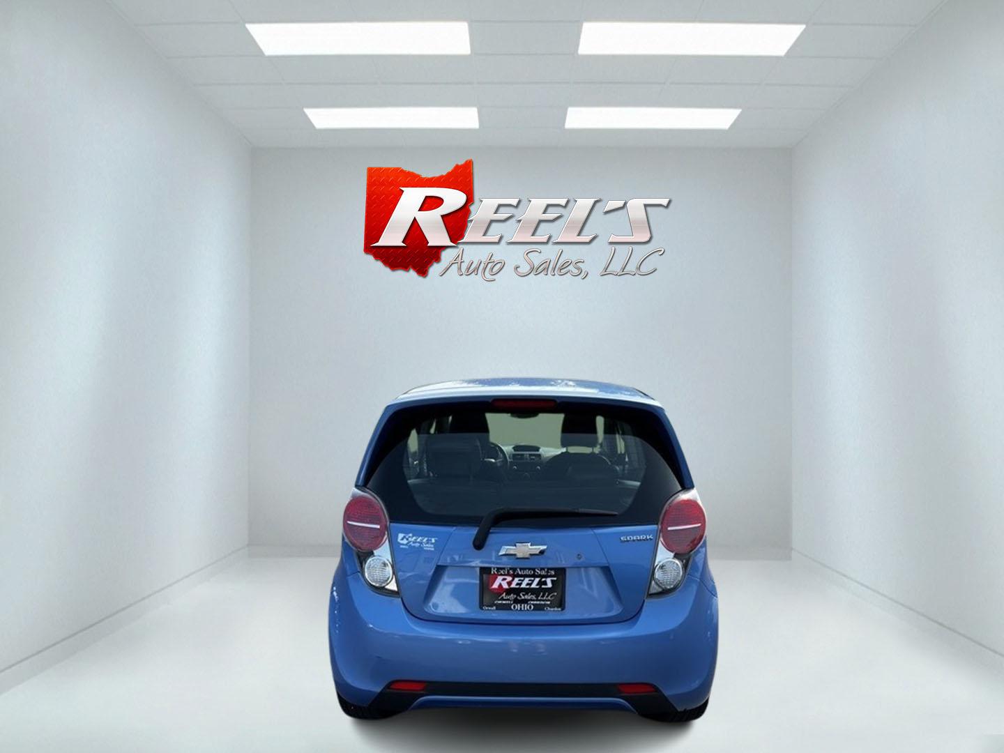 2014 Blue /Black Chevrolet Spark LS Auto (KL8CB6S9XEC) with an 1.2L I4 16V DOHC engine, Automatic transmission, located at 11115 Chardon Rd. , Chardon, OH, 44024, (440) 214-9705, 41.580246, -81.241943 - This 2014 Chevrolet Spark LS is a compact hatchback equipped with a 1.2 I4 engine and a CVT transmission, designed to offer efficiency and practicality for urban driving. It features daytime running lights and dusk-sensing headlights for improved visibility and safety. The Spark delivers a respectab - Photo#6