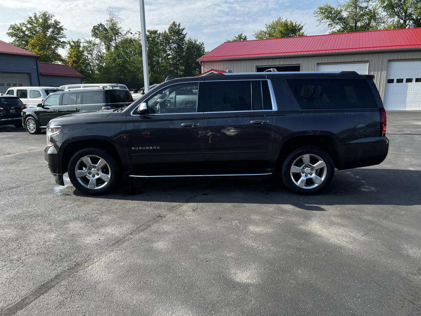 2017 Gray /Black Chevrolet Suburban Premier 4WD (1GNSKJKCXHR) with an 5.3L V8 OHV 16V engine, 6-Speed Automatic transmission, located at 547 E. Main St., Orwell, OH, 44076, (440) 437-5893, 41.535435, -80.847855 - This 2017 Chevrolet Suburban Premier 4WD is a robust full-size SUV powered by a 5.3-liter V8 Vortec engine with a 6-speed automatic transmission, offering a towing capacity of 6,000 pounds and equipped with a G80 locking rear differential and 3.08 gearing. It boasts an array of luxury and technology - Photo#16