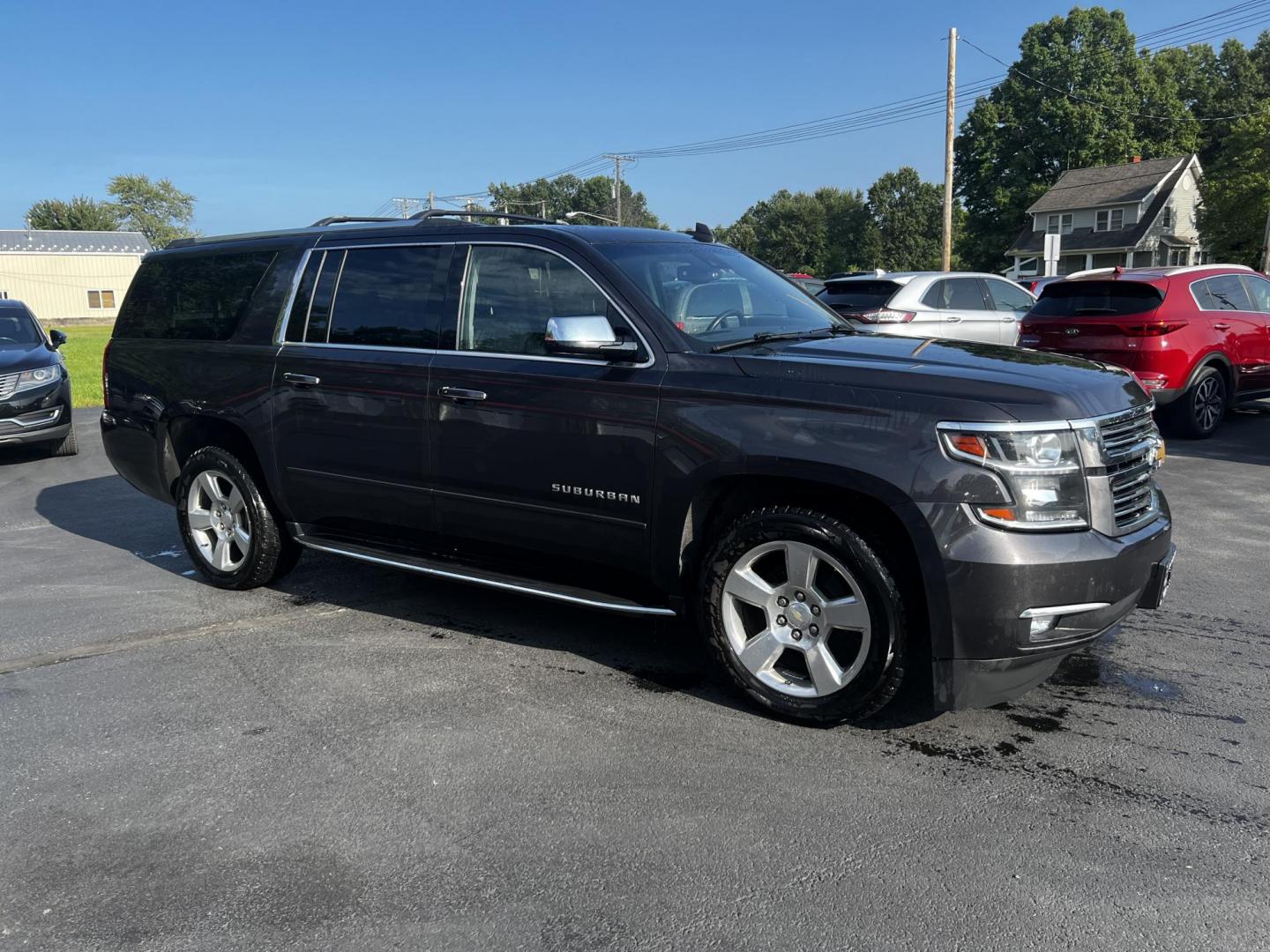 2017 Gray /Black Chevrolet Suburban Premier 4WD (1GNSKJKCXHR) with an 5.3L V8 OHV 16V engine, 6-Speed Automatic transmission, located at 547 E. Main St., Orwell, OH, 44076, (440) 437-5893, 41.535435, -80.847855 - This 2017 Chevrolet Suburban Premier 4WD is a robust full-size SUV powered by a 5.3-liter V8 Vortec engine with a 6-speed automatic transmission, offering a towing capacity of 6,000 pounds and equipped with a G80 locking rear differential and 3.08 gearing. It boasts an array of luxury and technology - Photo#3