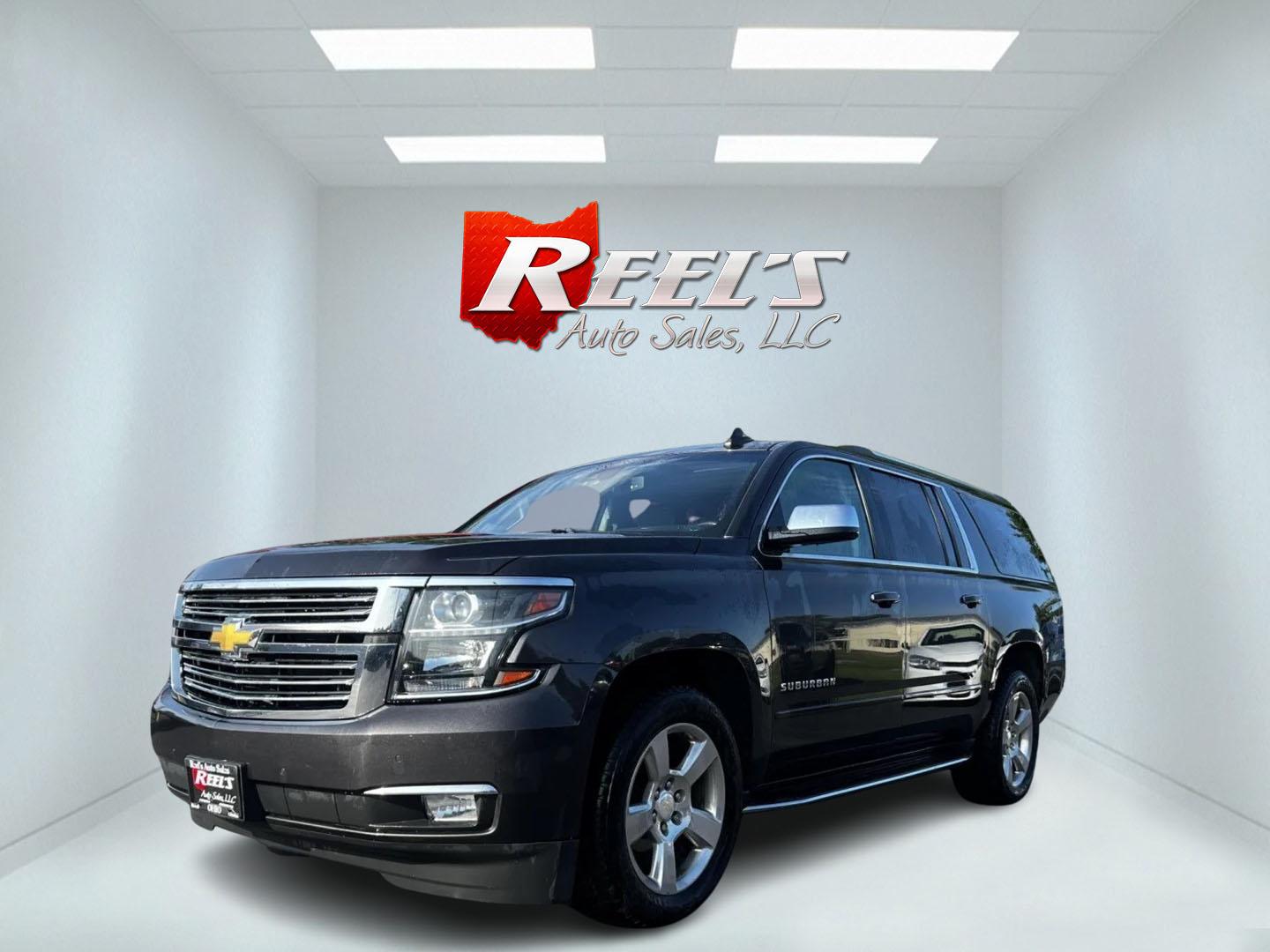 2017 Gray /Black Chevrolet Suburban Premier 4WD (1GNSKJKCXHR) with an 5.3L V8 OHV 16V engine, 6-Speed Automatic transmission, located at 547 E. Main St., Orwell, OH, 44076, (440) 437-5893, 41.535435, -80.847855 - This 2017 Chevrolet Suburban Premier 4WD is a robust full-size SUV powered by a 5.3-liter V8 Vortec engine with a 6-speed automatic transmission, offering a towing capacity of 6,000 pounds and equipped with a G80 locking rear differential and 3.08 gearing. It boasts an array of luxury and technology - Photo#0