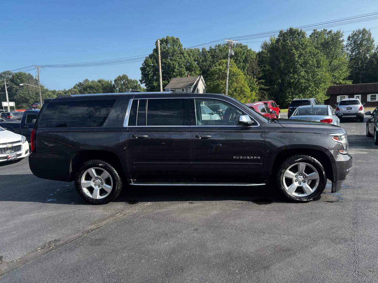 2017 Gray /Black Chevrolet Suburban Premier 4WD (1GNSKJKCXHR) with an 5.3L V8 OHV 16V engine, 6-Speed Automatic transmission, located at 547 E. Main St., Orwell, OH, 44076, (440) 437-5893, 41.535435, -80.847855 - This 2017 Chevrolet Suburban Premier 4WD is a robust full-size SUV powered by a 5.3-liter V8 Vortec engine with a 6-speed automatic transmission, offering a towing capacity of 6,000 pounds and equipped with a G80 locking rear differential and 3.08 gearing. It boasts an array of luxury and technology - Photo#6