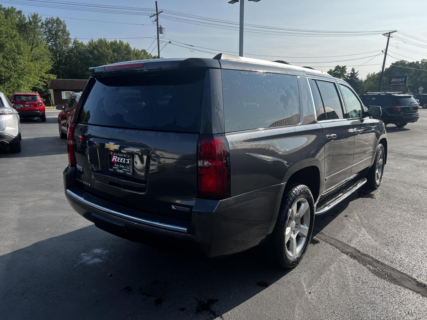 2017 Gray /Black Chevrolet Suburban Premier 4WD (1GNSKJKCXHR) with an 5.3L V8 OHV 16V engine, 6-Speed Automatic transmission, located at 547 E. Main St., Orwell, OH, 44076, (440) 437-5893, 41.535435, -80.847855 - This 2017 Chevrolet Suburban Premier 4WD is a robust full-size SUV powered by a 5.3-liter V8 Vortec engine with a 6-speed automatic transmission, offering a towing capacity of 6,000 pounds and equipped with a G80 locking rear differential and 3.08 gearing. It boasts an array of luxury and technology - Photo#8